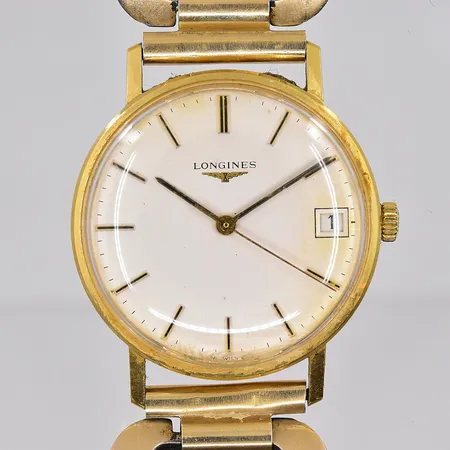 Herrur Longines 18K, boett Ø34 mm, manuell, datum, boettnr 19330384, länk i stål/doublé, fungerar ej/står still, graverad bakboett, originaletui medföljer, inga övriga tillbehör, bruttovikt 59,4g.