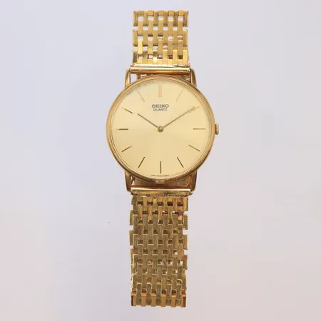 Herrur Seiko 18K Ø32mm, boett nr. 7703171 / 78-9009-D, (obs går ej),  med korridorlänk i 18K guld, 1980-tal, bruttovikt 69,1g 