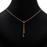 Collier, 18K guld, modell med två hängande Klot Ø 3 mm, Balestra, total längd 39,0 - 42,0 cm, bredd 1,3 mm, hängets totala längd 38 mm, fint skick Vikt: 2,1 g