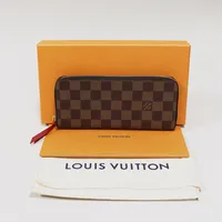 Plånbok Louis Vuitton Clémence wallet, 19,5x8,5cm, brun canvas med detaljer i gulmetall, rött foder, dustbag, box.