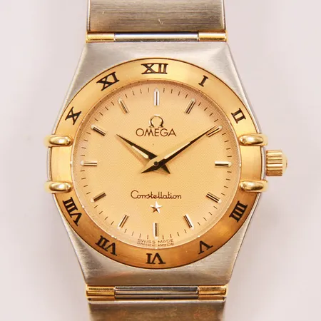 Damur Omega constellation, stål/guld, quartz, 25mm, halvstav, länknr: 6552/864, boettnr: 55860522, inga tillbehör