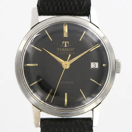 Armbandsur Tissot Visodate Seastar, Ø35mm, refnr:57050-1, manuell, stål, svart urtavla med guldfärgad stavindex, datumfönster, plastglas, 1960-tal, verknr:4600824, originalrem, bakboett med repor/bucklor, plastglas med repa mellan klocka 10-11, bruttovikt 38,1g, i servicebehov