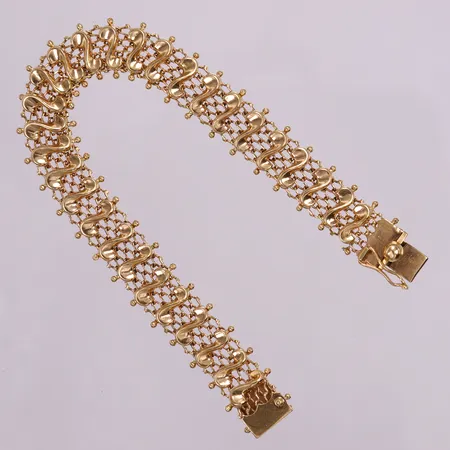 Armband, ca 18,5cm, bredd 2,5mm, en länk av. 18K Vikt: 17,6 g