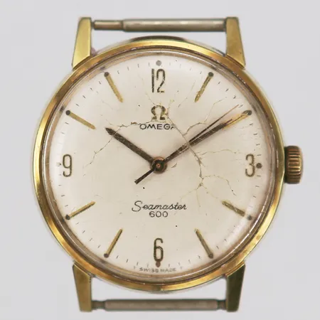 Herrur Omega, Seamaster 600, manuell, Ø 34mm, snr: 10679.1105, repig, kraftigt slitage samt sprickor på glas,  ca 1960-tal, doublé, guld på stål. 