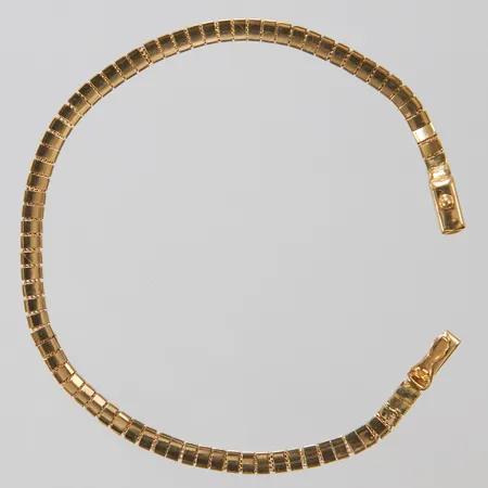 Armband, längd:19cm, bredd:3,5mm, något skev, lagningar, 18K. Vikt: 7,6 g