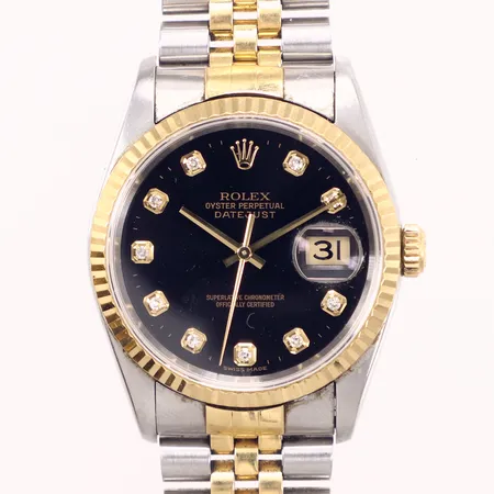 Herrur, Rolex Datejust, stål/guld, 36mm, automatisk, refnr: 16233, snr: W521364, verknr: 7267815, ca år 1995, svart urtavla med diamantindex, datum, safirglas med mindre nagg ca kl. 8, jubiléelänk i stål/guld repig, slapp i länk, manual, box, ytterkartong med stötskador, inga övriga tillbehör 