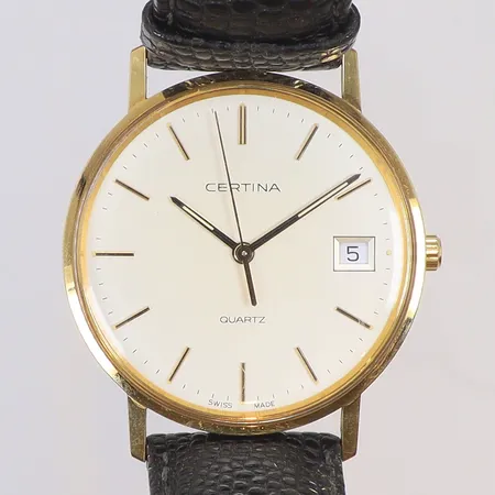 Herrur Certina 14K Ø33,5mm, boett nr. EOL.115.9299.65 quartz (går ej, troligen batteribyte), datum, personlig gravyr, läderband med slitage samt originalbox, ca 1990, guld i boett, bruttovikt 27,6g