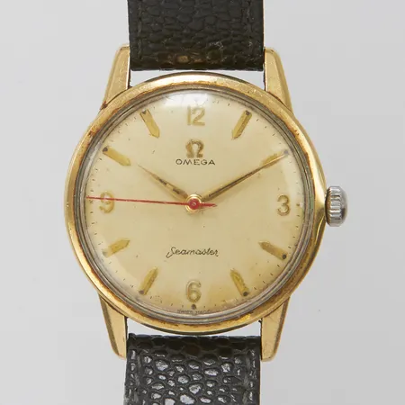 Herrur, Omega Seamaster, Ø35mm, manuell, boettnummer:14390-5SC, Cal:285, serienummer:18120755 ca 1961, guld på stål, skadad urtavla, repigt glas, läderband, längd:23,5cm, ej originalspänne.