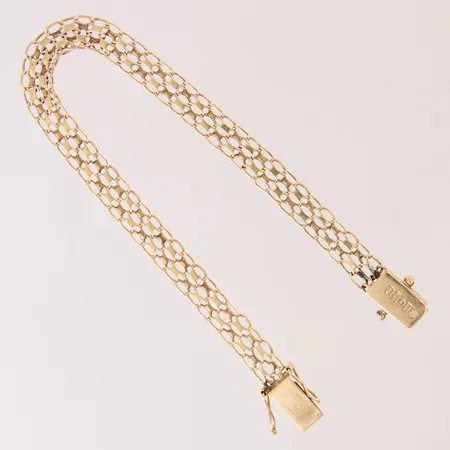 Armband X-länk med stav, längd 18cm, bredd 6,3mm, ojämn, 18K.  Vikt: 7,2 g