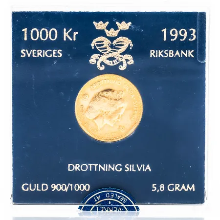 Mynt "DROTTNING SILVIA" i 21,6K guld i etui. 5,8g 900/1000. Nominellt värde 1000kr.