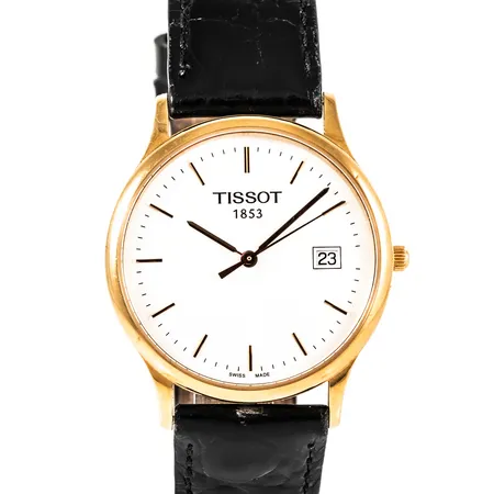 Herrur Tissot 1853 i 18K guld med läderband. Boett Ø 33,5 mm med gravyr "För nit...". Safirglas. Datum. Quartz- går ej- batteribyte krävs?