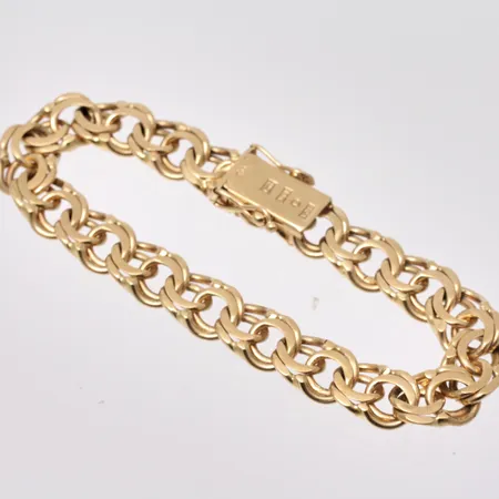 Armband i 18K guld, 19,5cm, Bismarck, bredd 10,20mm, tillverkad av Ahlms Guld Och Silververkstad, år 1965, vikt 38,74g.