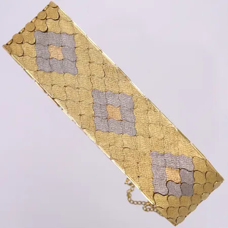 Armband tvåfärgad, ca 19,5cm, bredd 23mm, med säkerhetskedja, smärre slitage 18K.  Vikt: 78,4 g