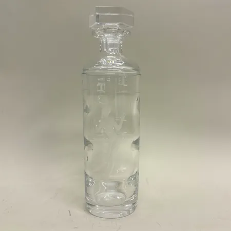 Karaff med propp, cylinderformad med dekor av kvinnofigur och fisk i bubblor, höjd 29cm, signerad Tage Cronqivst, Kosta, 1937 K.K. 104, nagg vid proppbotten, bruksslitage, kristall  Vikt: 0 g