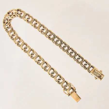 Armband Bismarck, längd 19,5cm, bredd 7mm, något slappa låsåttor, 18K  Vikt: 20,2 g
