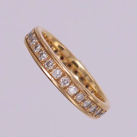 Ring, helallians med diamanter 30x0,03ct, stl 18½, bredd 4mm, Schalins. 18K  Vikt: 5,1 g