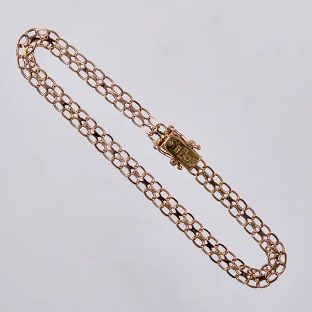 Armband X-länk längd: ca 19cm, bredd: ca 5mm, TC, år 1976, 18K  Vikt: 4,7 g