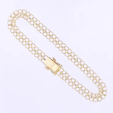 Armband X-länk 19cm, bredd 6mm, svenska stämplar, något bucklig, 18K Vikt: 5,6 g