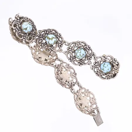 Armband med turkosa stenar längd 19cm bredd 8mm-20mm liten skada i ena stenen vitmetall