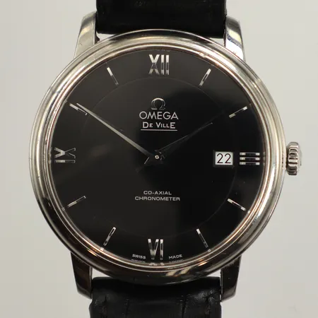 Herrur Omega De Ville Prestige Co-Axial, , stål, automatisk, ca 39,5mm, refnr 424.13.40.20.01.001, serienr 89782332, Cal 2500, datum, slitet läderarmband, smärre nagg på glasring, repor på boett, certifikat Bo Berggren daterat 2019-01-07, pictogramkort, manual, tag, box, skadad ytterkartong. 