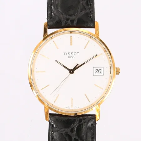 Herrur Tissot, 18K guld, quartz, datum, Ø36, med originalläderband, gravyr, originaletui och ytterfodral (med påskrift). Vikt: 0 g