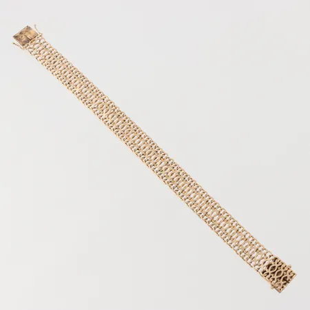 Armband Ädelsmycken Aktiebolag Stockholm 1967, längd 21 cm, bredd 13.4 mm, 18k. Vikt: 29,1 g