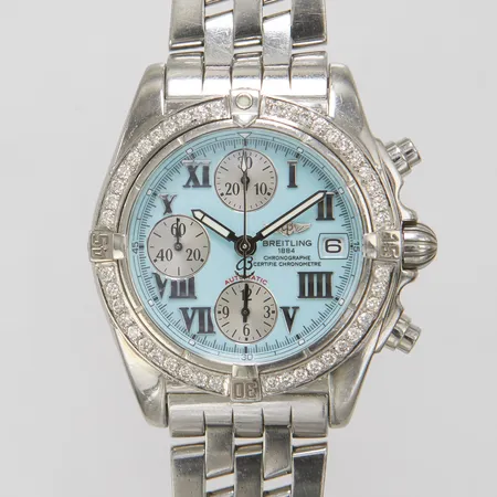 Herrur Breitling Chrono Galactic, stål, automatisk, 39mm, ref: A13358, snr: 2069164, Cal. B13 (7750), safirglas, datum, kronograf, turkos tavla med romerska siffror, eftersatta diamanter i vridring, pilotlänk, viklås, inga tillbehör, klocka tillverkad vecka 27 2005, länk tillverkad vecka 25 2005