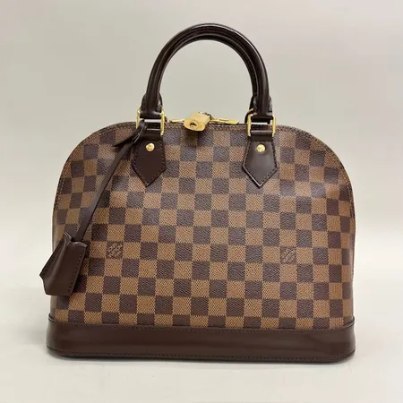 Väska Louis Vuitton, Alma PM Damier Ebene canvas, rött foder, datumkod, tillverkad i Frankrike 2011, beslag i guldfärgad metall, hänglås med två nycklar, kvittokopia Louis Vuitton Milano December  2011, ca mått 31x15x22cm, dustbag, inga övriga tillbehör