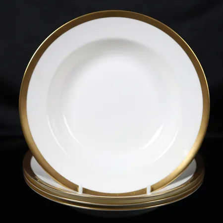 Fyra djupa tallrikar, "Nobel", formgiven av Karin Björquist, porslin med guldkant, Ø ca 22cm, bruksslitage, repor.  Vikt: 0 g Skickas med postpaket.