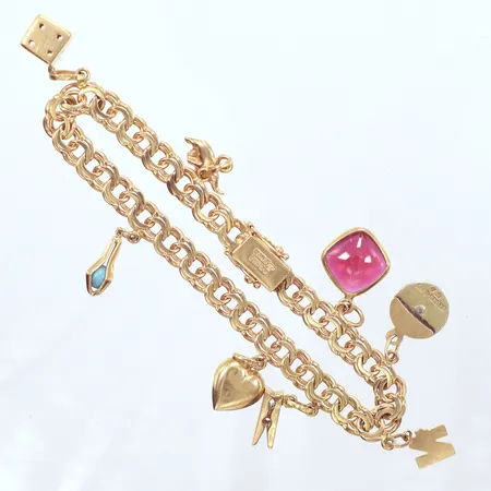 Armband Bismarck med 7 berlocker, längd 20cm, bredd 6,5mm, 18K Vikt: 23,8 g
