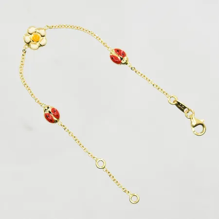 Armband med fasta berlocker, längd 13½-15½ cm, länkens bredd 1 mm, 18K. Vikt: 3 g