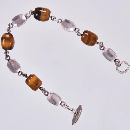 Armband med Tigeröga, längd: ca 20,5cm, bredd: ca 4-10mm, AMS, Saarela Arvo, år 1964, 830/1000 silver  Vikt: 20,1 g