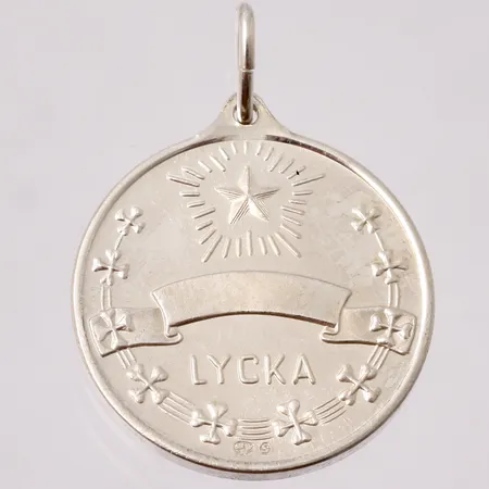 Hänge i silver, Lycko penning, mått 21x29mm, ograverad, 830/1000, vikt 5g.