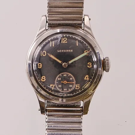 Herrur Longines, 32mm, stål, manuell, boettnr:23427/354, verknr:7234868, patinerad svart urtavla, spricka i plexiglas, ny lume på minutvisare, flexband.