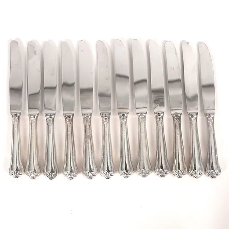 Tolv, förrättsknivar, modell "Symfoni", MEMA, Lidköping, längd 17cm, slitage, stålblad och silver, bruttovikt 344,1g Vikt: 0 g