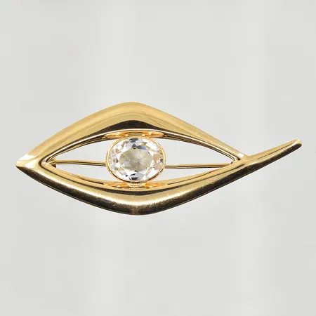Brosch med vit sten, bredd 54 mm, höjd 22 mm, 14K. Vikt: 2,9 g