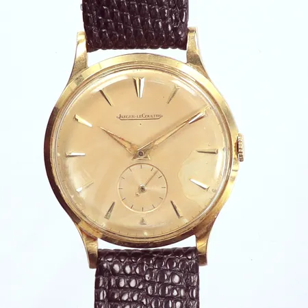 Herrur Jaeger LeCoultre, guld på stål,  Ø 33,5mm, manuell, fungerar ej, sekundvisare, fläckig urtavla och visare, skinnband ej original