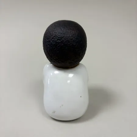 Figurin "Syd", Lisa Larsson för Rörstrand, stengods, ur serien "All världens barn", höjd ca 10cm, signerad.