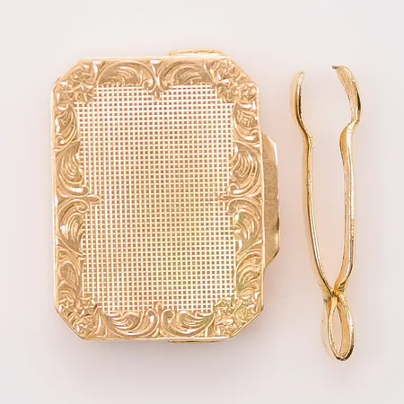 Pillerdosa, 28x22x6mm, Juvelfabriken AB, 1942, monogramgrayr på insida lock, 18K 12,4g. Tillhörande tång i oädel metall