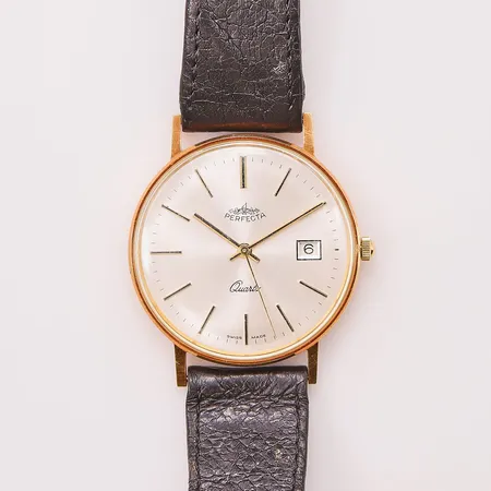 Herrur Perfecta 18K, 33mm, quartz, graverad, går ej.