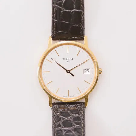 Herrur Tissot 18K, 33,5mm, quartz, graverad, läderband, går ej.