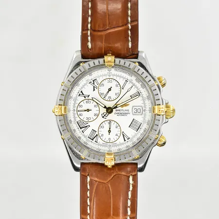 Herrur Breitling Crosswind, boett Ø44 mm, ref B13055, (0663) serienr 46720275, guld/stål, cert från 24/2-2000, armband med viklås, böcker, skadad box, defekt ytterkartong.