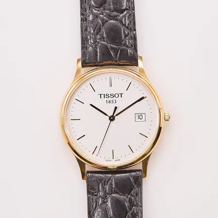 Herrur Tissot 18K, 33mm, quartz, gravyr, går ej, fint skick, originalbox.