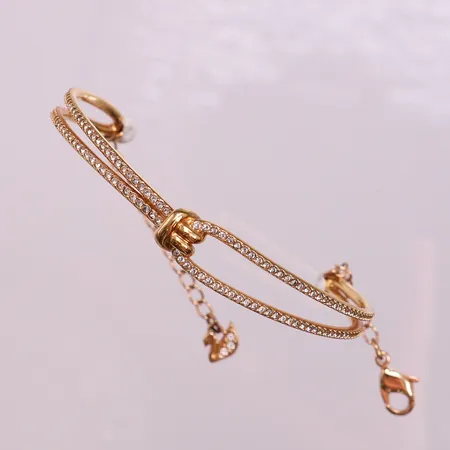 Armband Swarovski, Ø59mm, bredd 4-9mm, förgylld metall. 