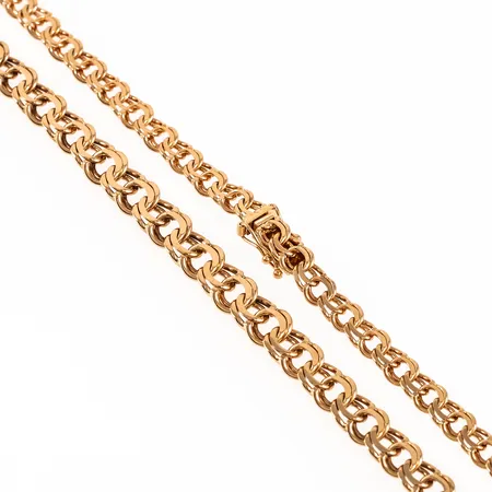Colliér Bismarck i 18K guld. Det är 5,3 - 7,3 mm brett, 46 cm långt och väger 27,5g. Kistlås. Stämplad S10 (1992), DDD (J H Juveler, Stockholm), 18K.