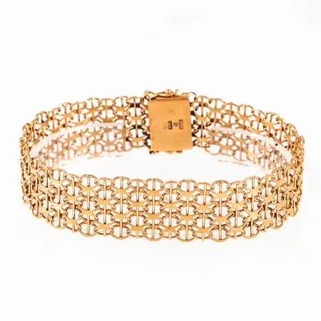 Armband X-länk i 18K guld. Det är 16,4 mm brett, 20 cm långt och väger 21,3g. Kistlås. Stämplad S9 (1968), UST (B Ustav, Hägersten), 18K & Kattfot. 