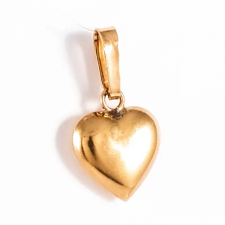 Hänge Hjärta i 18K guld. Det är 8,5 mm brett, 15,5 mm långt och väger 0,3g. Svaga bucklor. 
