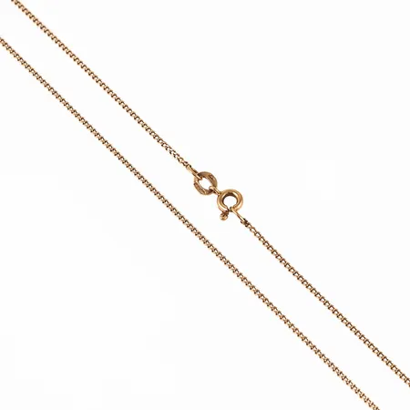 Kedja Pansar i 18K guld. Den är 1,1 mm bred, 48 cm lång och väger 2,6g. Springring. Slitna länkar närmast låset. 