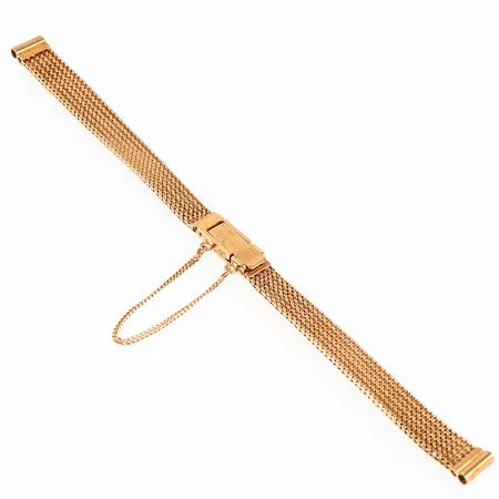 Urband i 18K guld. Det är 6 - 7,6 mm brett, 14 cm långt och väger 13,7g. Viklås. Säkerhetskedja. 