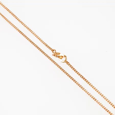 Kedja Pansar i 18K guld. Den är 1,2 mm bred, 47 cm lång och väger 2,3g. Ojämnheter. Stämpelögla använd som ändögla.